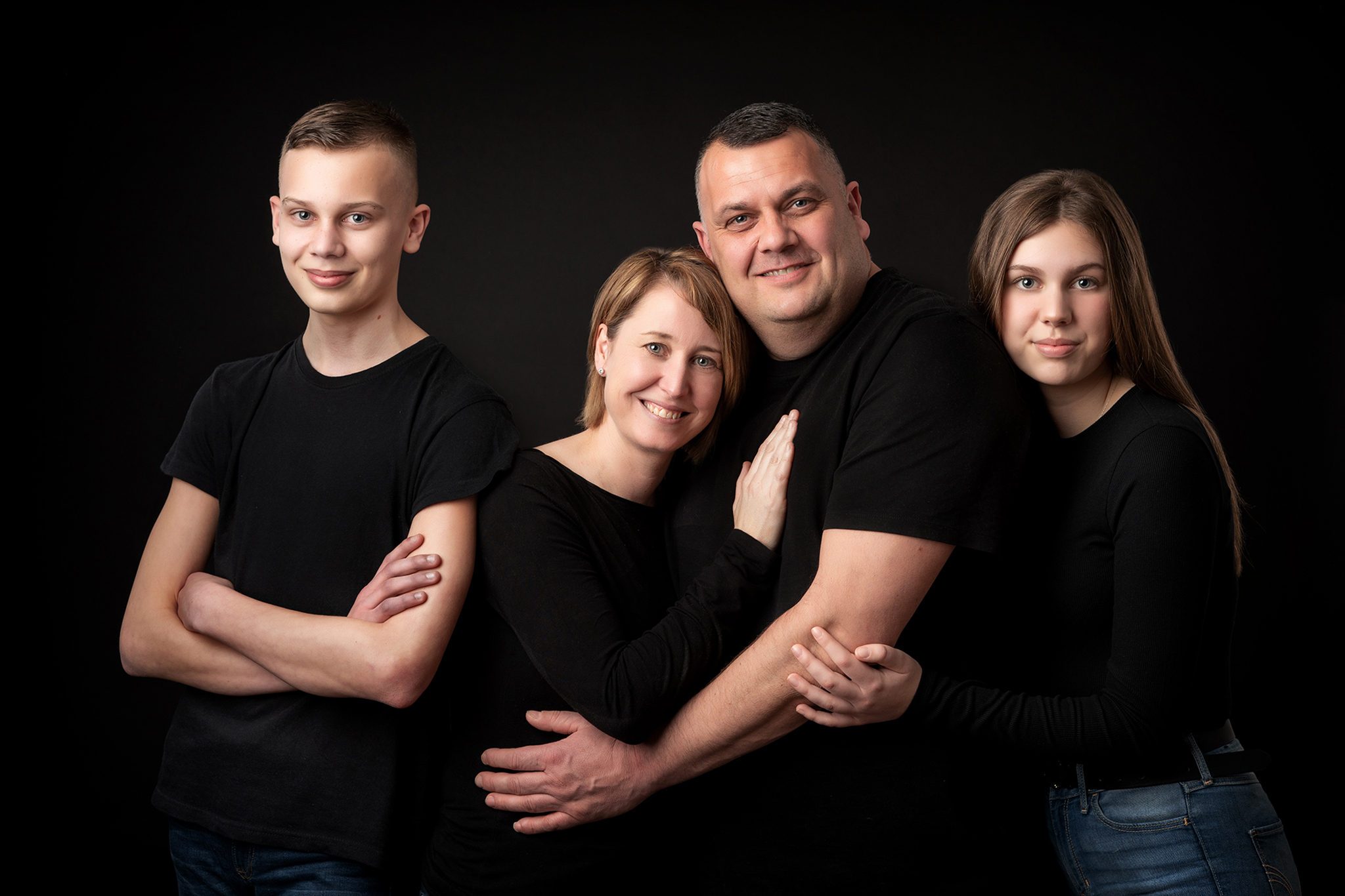family photograph parents with teenagers studio portrait by Family photographer Lancashire