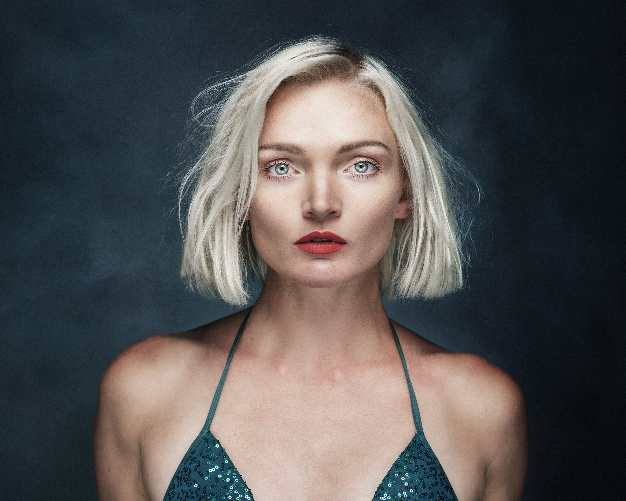 blonde with green top studio portrait by Boudoir Photographer Lancashire