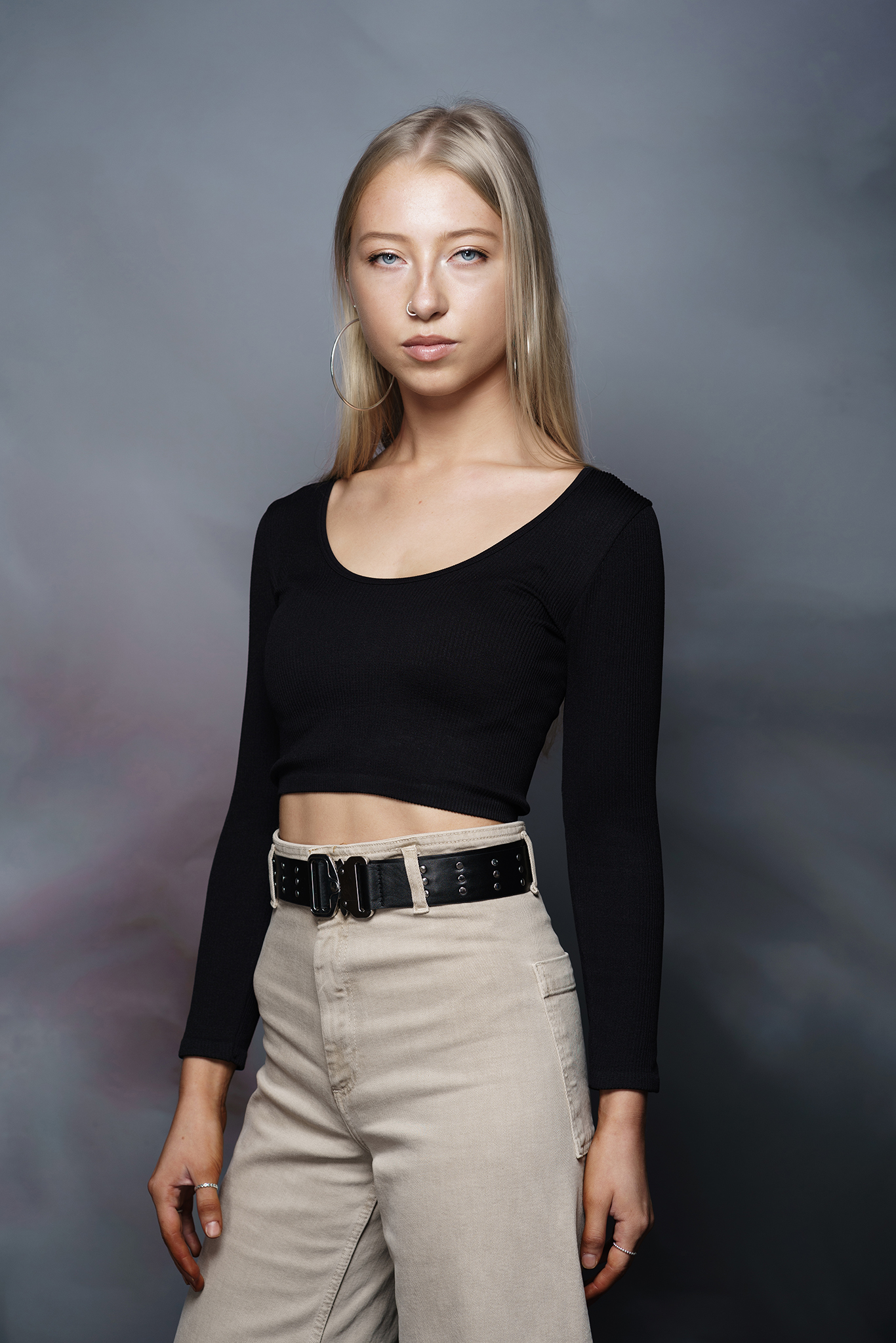 blonde model portfolio shot with grey background by Portrait photographer Preston